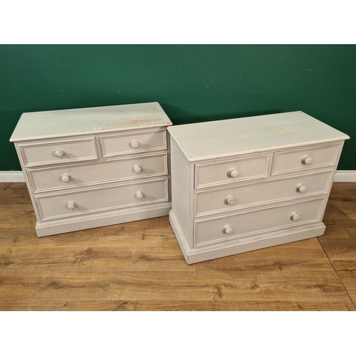 688 - A pair of modern grey painted Chests of two short over two long drawers on plinth bases, 27