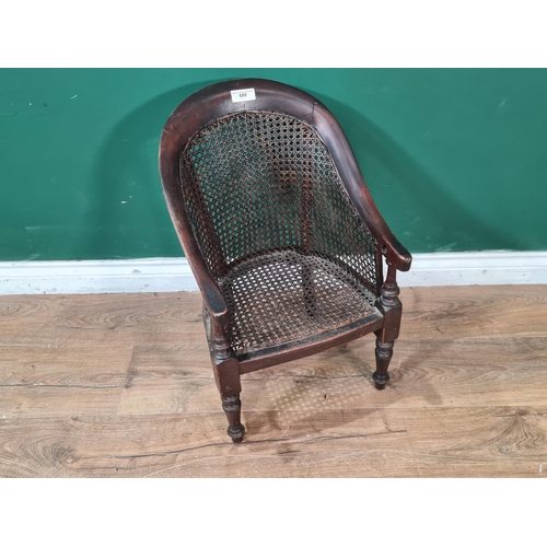 689 - A mahogany framed Childs Chair with cane-work back and seat, raised on turned front supports, A/F, 1... 