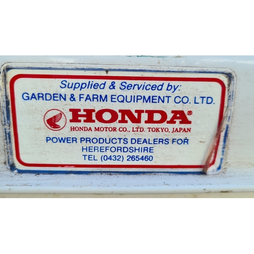 692 - A Cylinder Mower powered by a Honda Engine (no grass box)