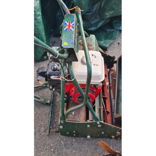 694 - An Atco Cylinder Ride-On Mower with seat roller and collection box