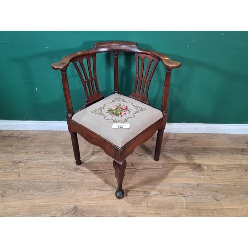 726 - An antique oak Corner Chair with pierced shaped splats, drop in floral upholstered seat cushion and ... 