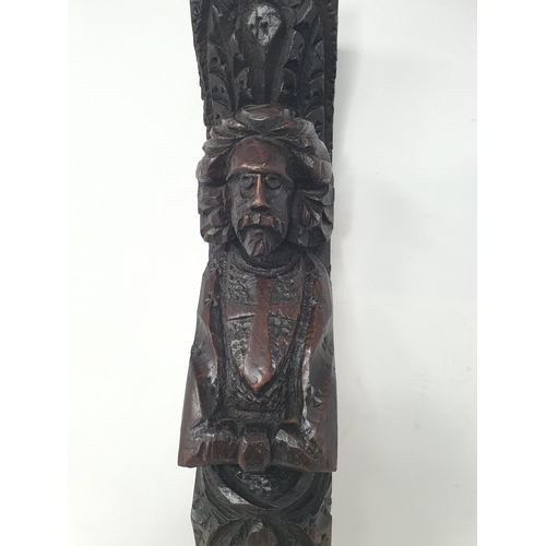 73 - An antique oak Caryatid depicting figure with folded arms, 17in (R6)