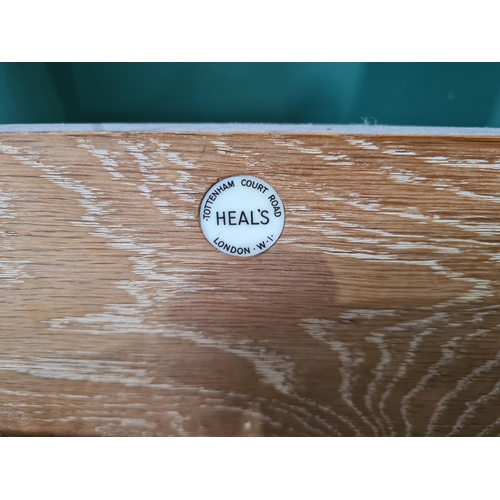 758 - A Heal's oak framed Single Bed bearing ivorine disc for 