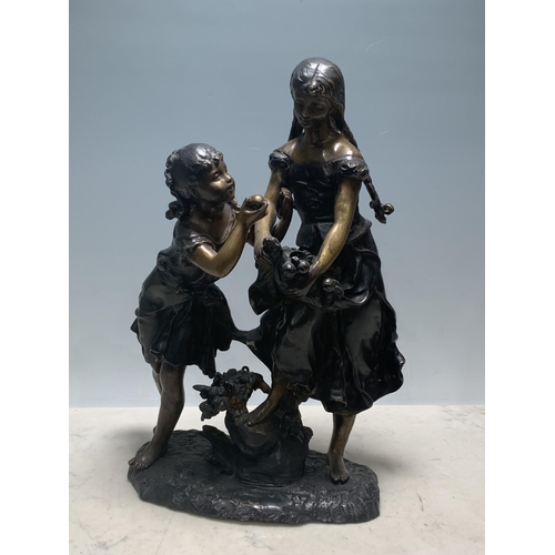 766 - A bronze Figure Group of two young girls, holding fruit on a naturalistic base, 16in H (R3)