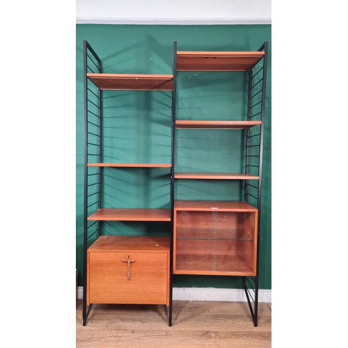 783 - A Ladderax Wall Unit with  fall front compartment, glazed bookcase and shelves 6ft 6in H x 4ft 1in W... 