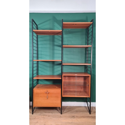 783 - A Ladderax Wall Unit with  fall front compartment, glazed bookcase and shelves 6ft 6in H x 4ft 1in W... 