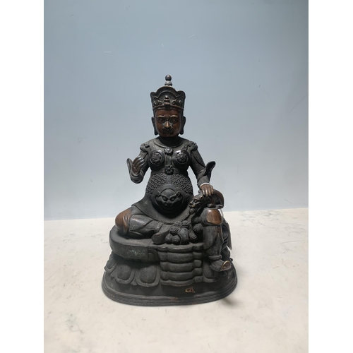 786 - A bronze effect seated Chinese Figure, 10 1/2in H (R7)