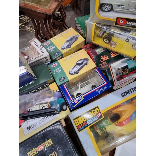 806 - A quantity of boxed Minichamps, Burago and other diecast Models of Vehicles (R10)