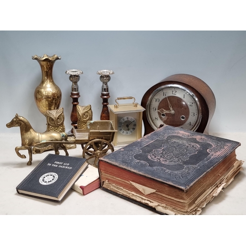 815 - A box containing pair of oak metal mounted Candlesticks, oak Mantle Clock, brass Vase, Horse and Car... 