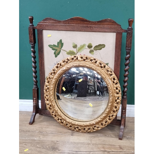 837 - An oak framed Tapestry Firescreen and a gilt framed circular Wall Mirror . (R8).