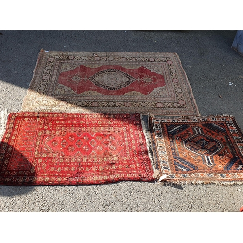 848 - A Persian style Rug with multiple borders with central medallion on a red ground, 5ft 9in x 3ft 11in... 