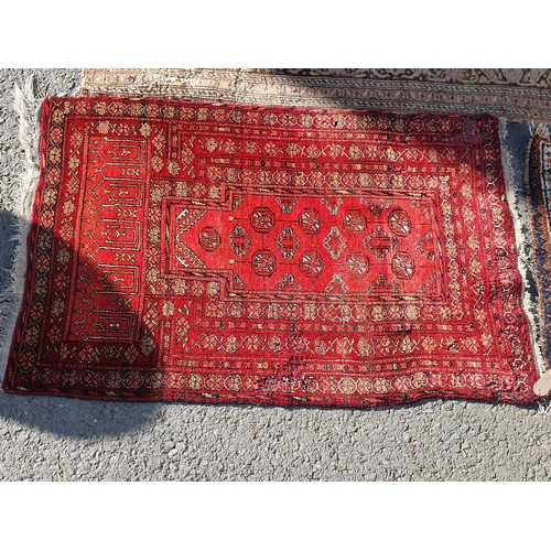 848 - A Persian style Rug with multiple borders with central medallion on a red ground, 5ft 9in x 3ft 11in... 