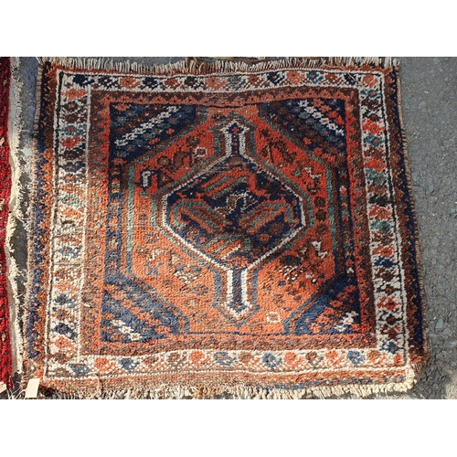 848 - A Persian style Rug with multiple borders with central medallion on a red ground, 5ft 9in x 3ft 11in... 