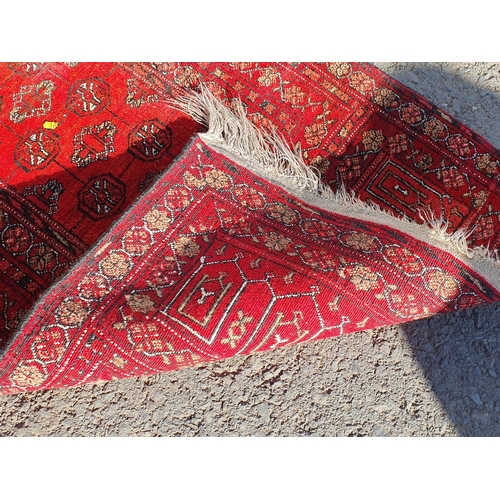 848 - A Persian style Rug with multiple borders with central medallion on a red ground, 5ft 9in x 3ft 11in... 