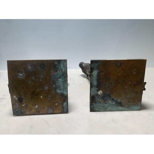 86 - Two bronze effect seated Tigers on stepped square bases, 11in H (R7)