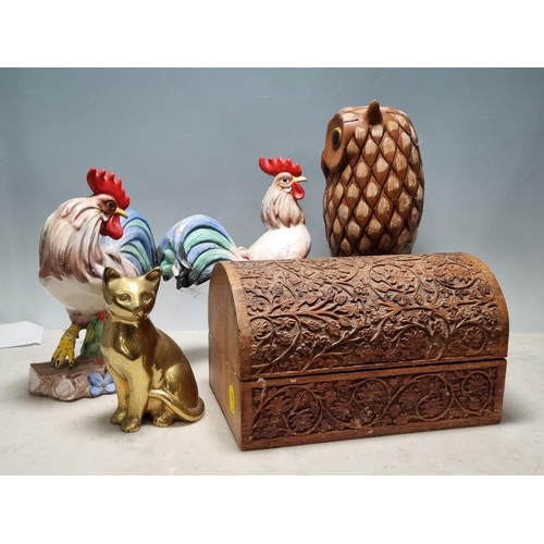 862 - A carved hardwood domed top Casket, two Italian Cockerel Figurines, a modern carved Owl, a brass sea... 