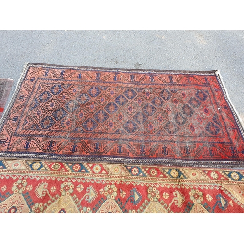 867 - A Runner on red ground with multi-floral borders with seven central stylised medallions, 10ft L x 2f... 