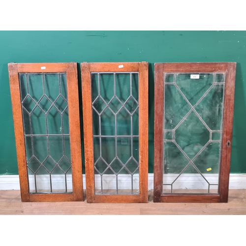 876 - A pair of oak framed leaded glass Cabinet Doors, 2ft 9