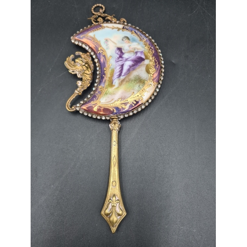 95 - A French Art Nouveau miniature Hand Mirror of crescent shape painted young lady, paste surround, che... 