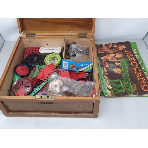 689 - A wooden box of Meccano Accessories and Instruction Pamphlets. (R5).