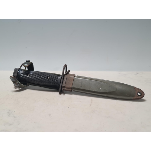 26 - A US M8A1 Bayonet with scabbard, a US Camillus Survival Knife with scabbard and another Knife (All A... 