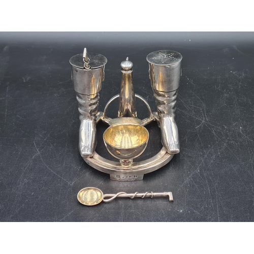 34 - An Elkington & Co plated Novelty Condiment Set in the form of a horeshoe with spur, pair of riding b... 