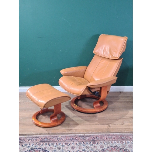 2 - A beige upholstered Armchair and matching Footstool. (R7).