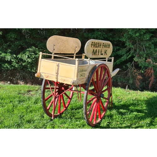 17 - An early 20th Century two wheeled Dairy Hand Cart with oval painted signs, inscribed 