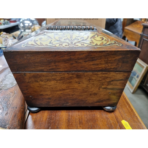 1 - A William IV rosewood Work Box of sarcophagus shape with ornate brass inlay, yellow interior with li... 