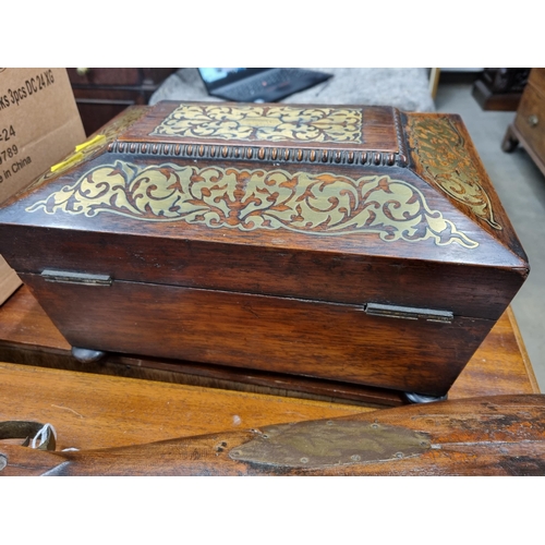 1 - A William IV rosewood Work Box of sarcophagus shape with ornate brass inlay, yellow interior with li... 