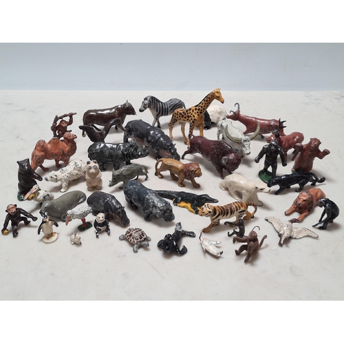 12 - A Collection of approximately 40 cast metal Zoo Animals to include, a Giraffe, Hippo, Lion, Sea Lion... 