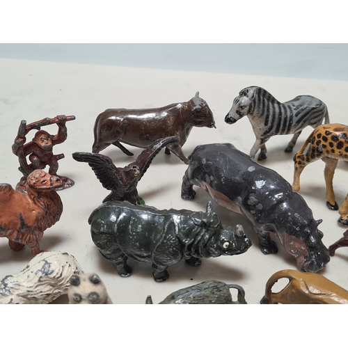 12 - A Collection of approximately 40 cast metal Zoo Animals to include, a Giraffe, Hippo, Lion, Sea Lion... 