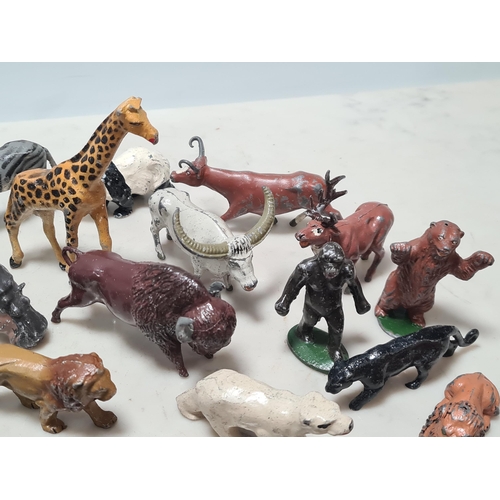 12 - A Collection of approximately 40 cast metal Zoo Animals to include, a Giraffe, Hippo, Lion, Sea Lion... 