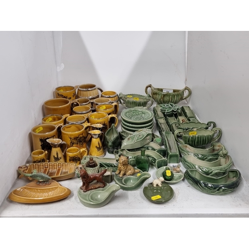 254 - A collection of Wade items to include, brown glazed Mugs designed by the Veteran Car Club, two Wade ... 