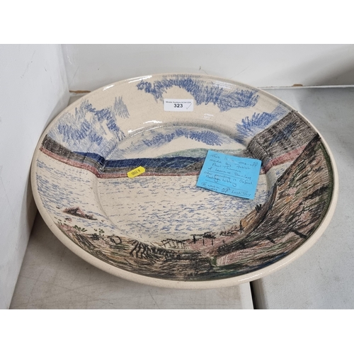 323 - A large pottery Bowl decorated with scene of Loch Tay, made by the Artist Paul Thomas of Leonard Sta... 