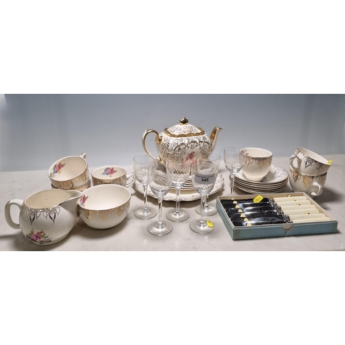 345 - A Swinnertons 'Golden Rhapsody' part Tea Set including Teapot, Cups, Saucers, Plates, etc, a set of ... 