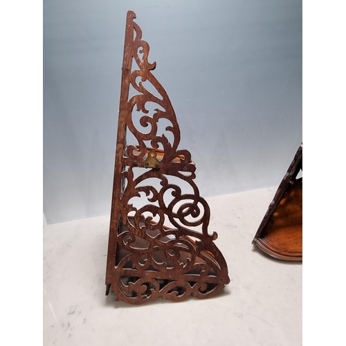 651 - A pair of mahogany carved and pierced Corner Wall Brackets/Shelves, with scrolled designs, A/F, 1ft ... 