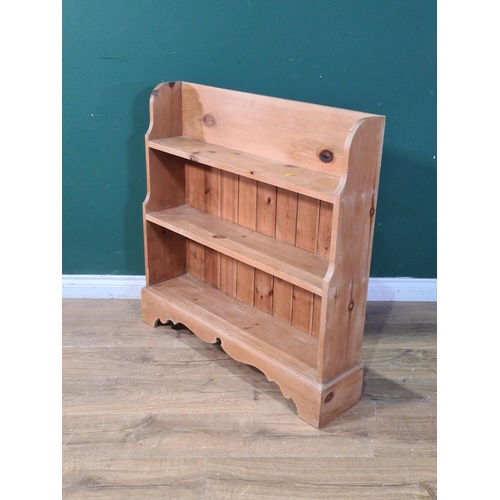 699 - A pine three tier open Bookcase with decorative bracket supports, 35