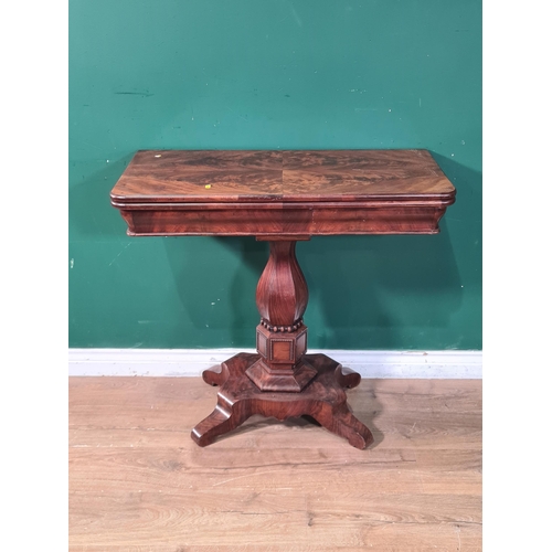 701 - A Victorian mahogany foldover Tea Table on octagonal baluster column and quatroform base, (R9)