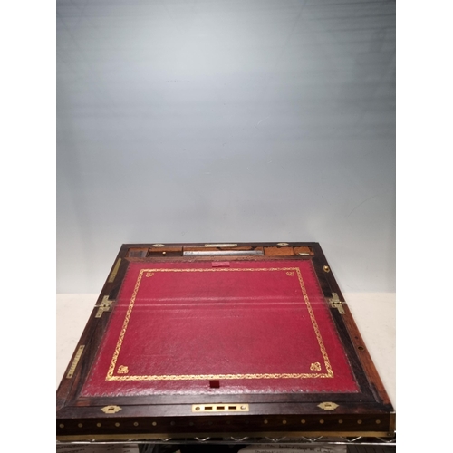 745 - A fine rosewood Writing Box with brass inlay, having a pair of brass candlesticks mounted when open,... 