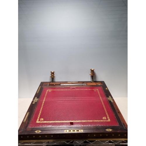 745 - A fine rosewood Writing Box with brass inlay, having a pair of brass candlesticks mounted when open,... 