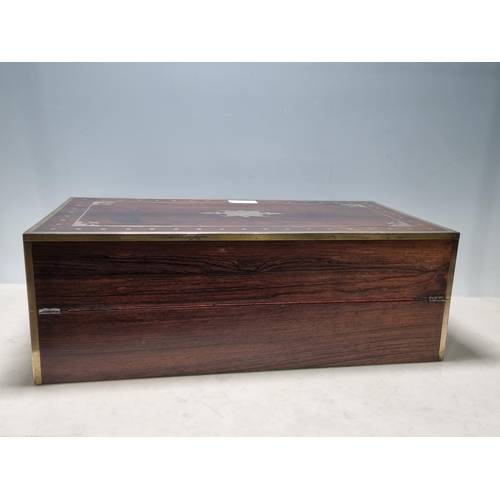 745 - A fine rosewood Writing Box with brass inlay, having a pair of brass candlesticks mounted when open,... 