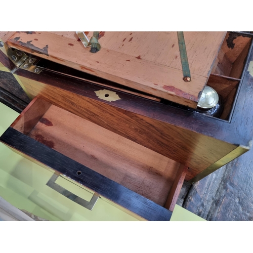 745 - A fine rosewood Writing Box with brass inlay, having a pair of brass candlesticks mounted when open,... 