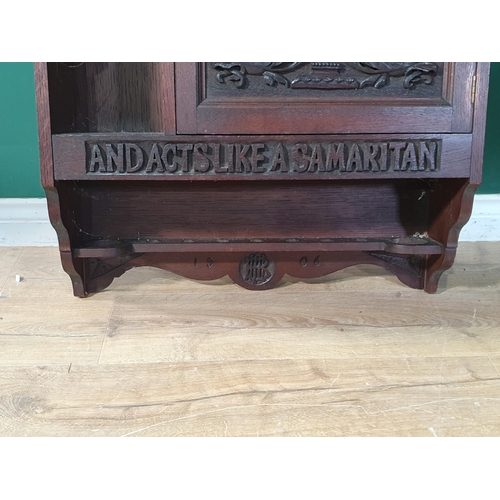 755 - A carved oak wall mounted Smoker's Cabinet 'The Man Who Smokes Thinks Like a Sage and Acts Like a Sa... 