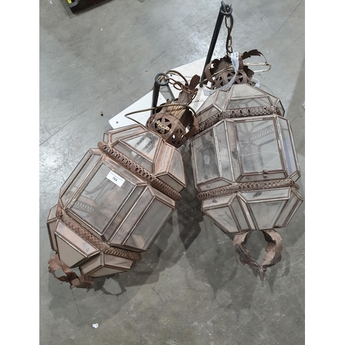 764 - A pair of pierced metal and glass panelled hexagonal Lanterns, 2ft 4in H, A/F, (R9)