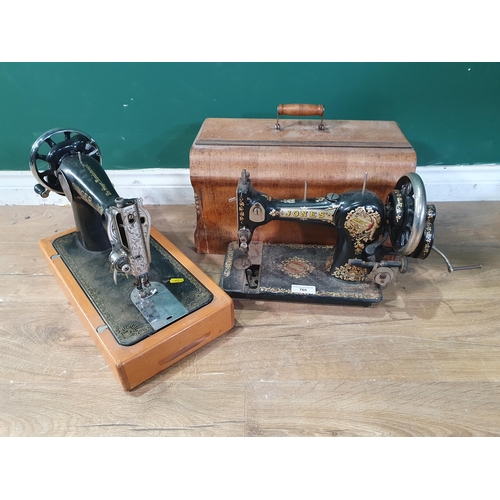 765 - A cast iron Singer Sewing Machine, and a Jones Sewing Machine, (R9)