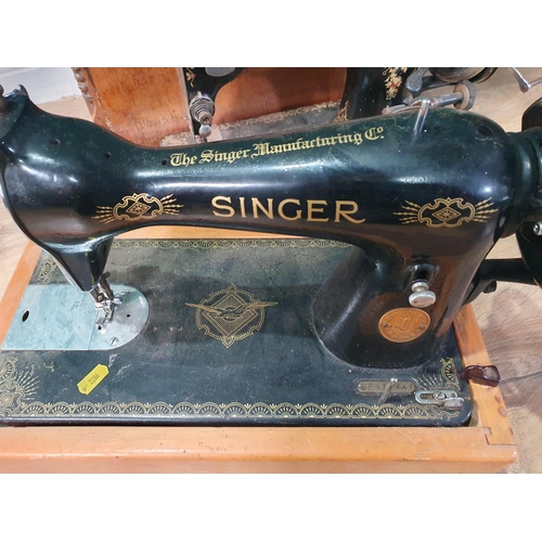 765 - A cast iron Singer Sewing Machine, and a Jones Sewing Machine, (R9)