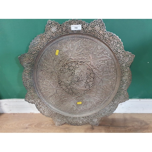 766 - A large circular pierced plated Tray with shaped rim and all over floral and leafage designs, 22