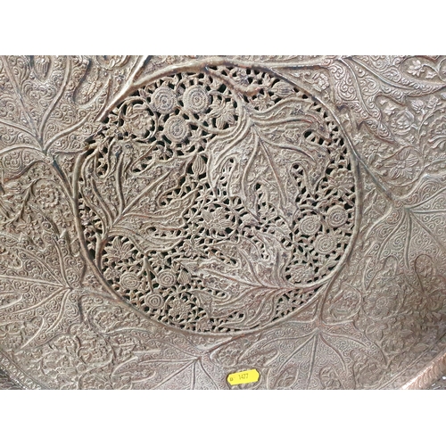 766 - A large circular pierced plated Tray with shaped rim and all over floral and leafage designs, 22