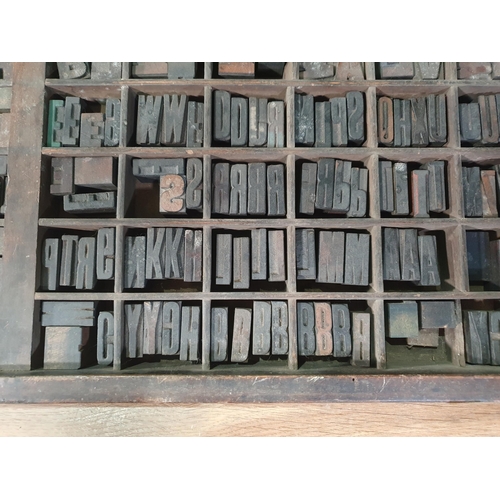 768 - A tray containing a a selection of assorted Printing Blocks mainly letters and some numbers. (R9).